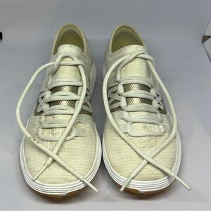 Under Armour White and Gold Athletic Shoes Sleek Design